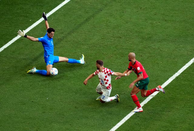Morocco goalkeeper Yassine Bounou saves from Croatia’s Nikola Vlasic 