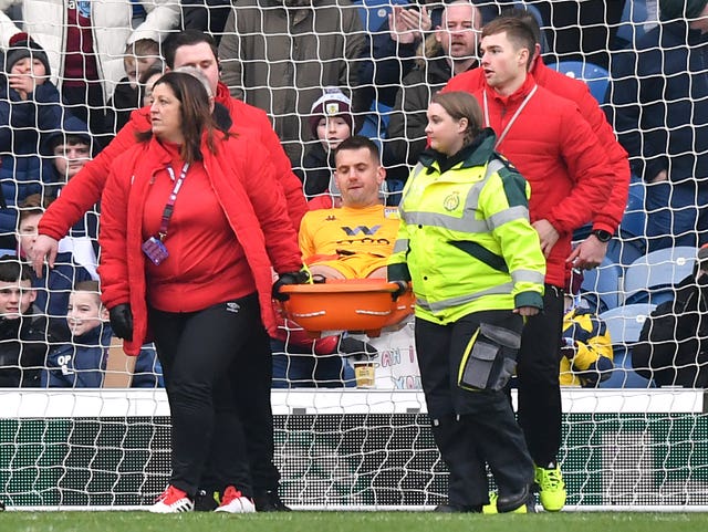 Tom Heaton is stretchered off against Burnley