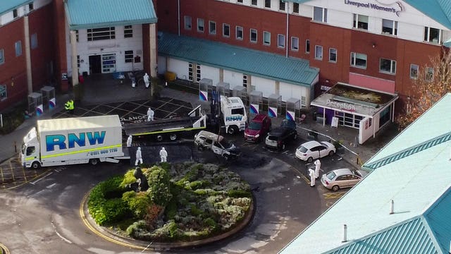 Aerial view of a damaged car being removed by forensic officers after the explosion at the Liverpool Women’s Hospital