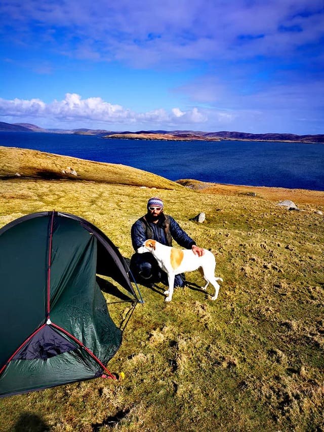 Chris Lewis with Jet, as he is isolating on an uninhabited island off Shetland after lockdown restrictions were announced