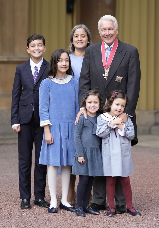 Professor Sir Philip Bobbitt with family members after being made a Knight Commander of the British Empire