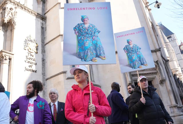 Protesters outside the High Court holding photos of Camila Batmanghelidjh under the words 'unrelenting love'