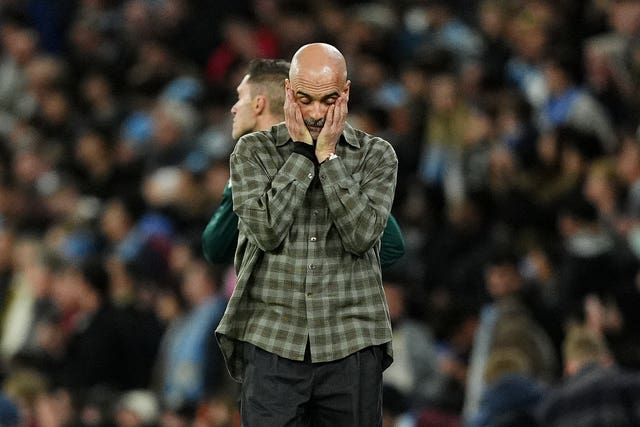 Manchester City manager Pep Guardiola puts his head in his hands as his side exit the Champions League