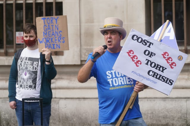 Protesters outside the Methodist Central Hall in Westminster, London, ahead of the announcement of the new Conservative party leader and next prime minister 