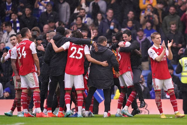 Mikel Arteta, second right, and Arsenal celebrate victory over Chelsea