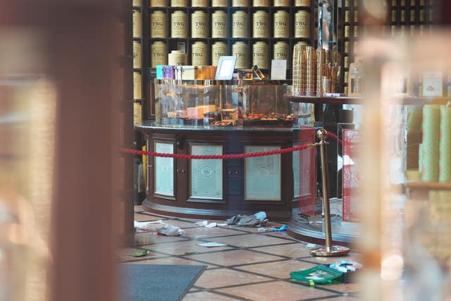 Discarded clothing and emergency medical equipment in the TWG Tea shop in Leicester Square, London