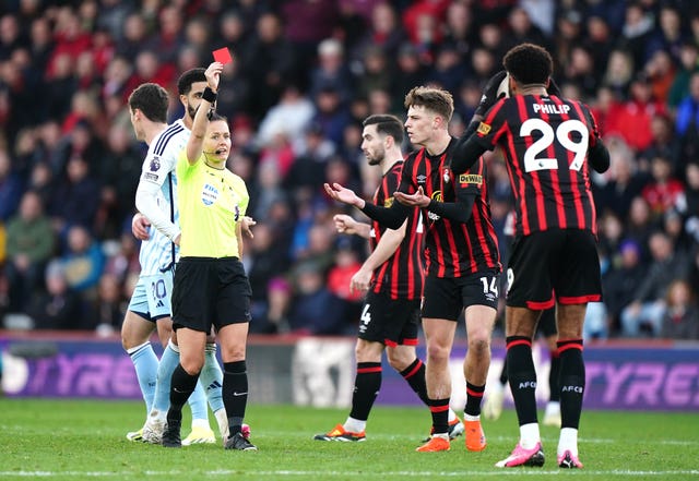 Bournemouth’s Philip Billing (right) is shown a red card by referee Rebecca Welch for serious foul play during the Premier League match at the Vitality Stadium, Bournemouth. 