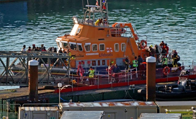 A group of people thought to be migrants are brought in to Dover, Kent, onboard the Dover Lifeboat following a small boat incident in the Channel (Gareth Fuller/PA)