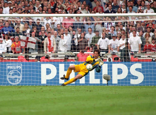 England goalkeeper David Seaman saves a spot-kick during a penalty shoot-out at Euro 96
