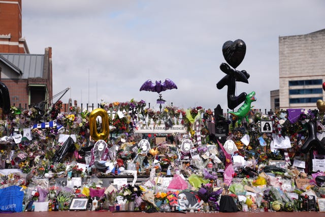 Tributes left at the Black Sabbath Bridge bench