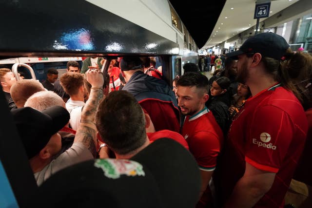 Liverpool fans board a train