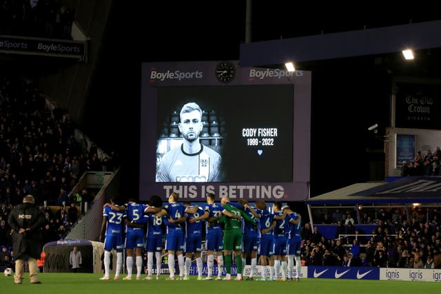 Players observe a minute's silence for Cody Fisher ahead of the Sky Bet Championship match at St. Andrew’s, Birmingham on December 30 2022 