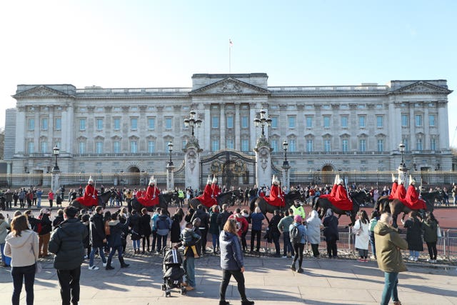 The usual throng of sightseers gathered outside the palace on Thursday (Yui Mok/PA)