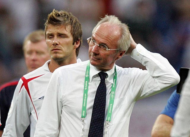 Sven-Goran Eriksson and David Beckham look dejected after losing against Portugal in the World Cup quarter-finals