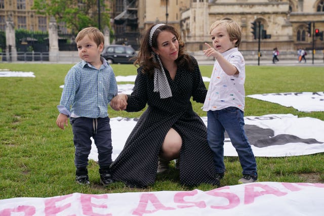 Stella Moris and her children Gabriel and Max join supporters for a picnic in Parliament Square