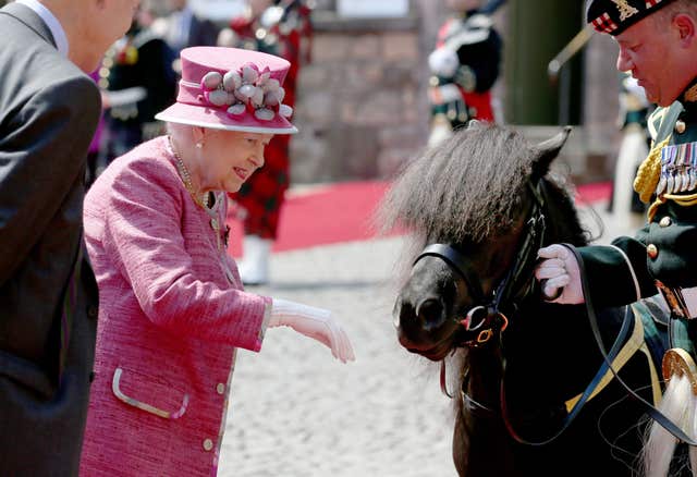 The Queen meets Shetland Pony Cruachan IV, the mascot of the Royal Regiment of Scotland, during a visit to Stirling Castle (Jane Barlow/PA)
