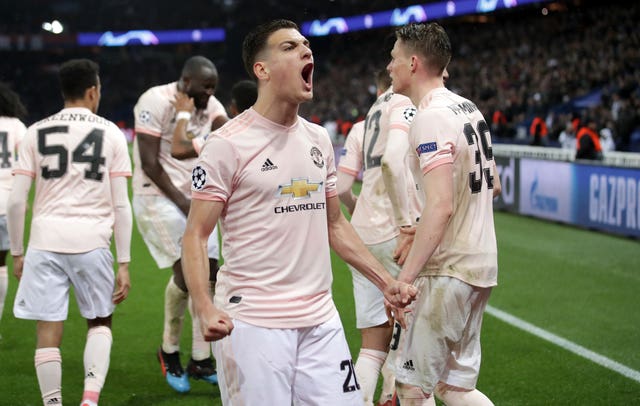 Diogo Dalot celebrates after Marcus Rashford (not pictured) scores United's crucial third goal