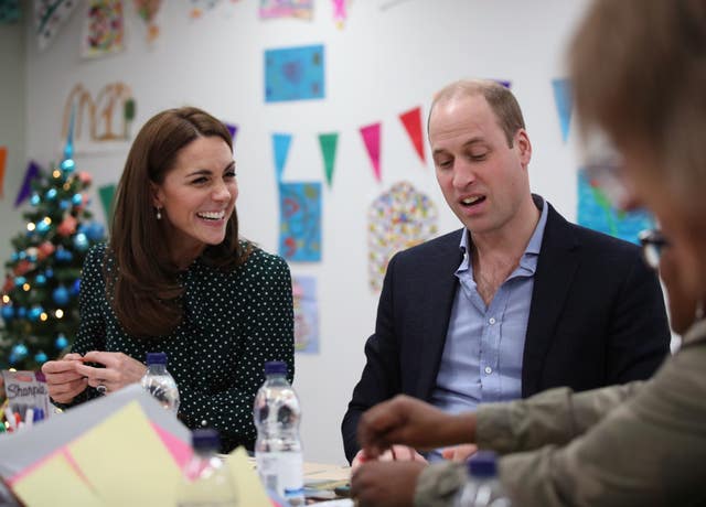 The Duke and Duchess of Cambridge take part in an arts and craft session with clients, during their visit to the homeless charity The Passage last December. Yui Mok/PA Wire