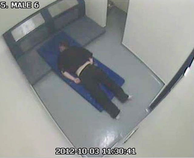 CCTV still issued by the Independent Police Complaints Commission of Thomas Orchard in a cell at Heavitree Road police station (IPCC/PA)