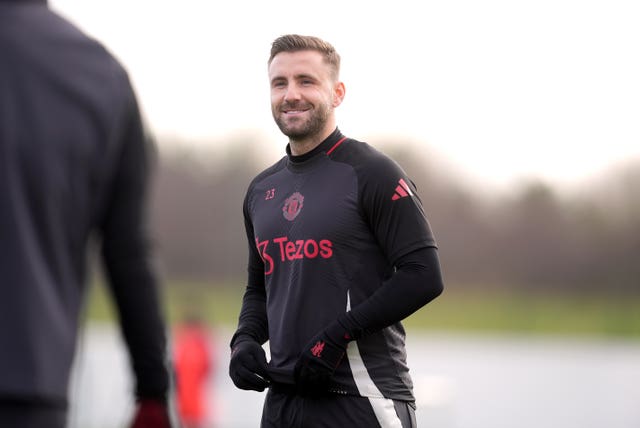 Luke Shaw smiles during training