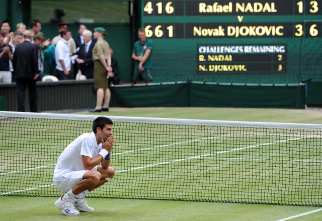 Novak Djokovic celebrates his win over Rafael Nadal at Wimbledon 2011