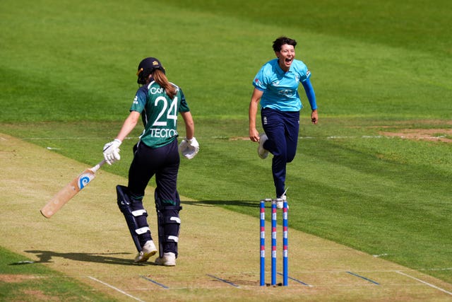 Issy Wong, right, celebrates a wicket