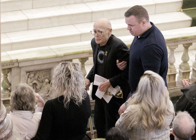 Eamonn McCann being aided after giving a eulogy to Nell McCafferty at St Columba’s Church