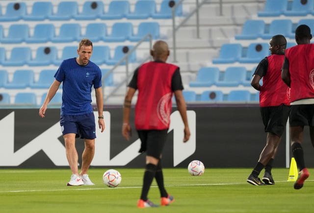 England’s Harry Kane plays with the Workers’ Welfare ‘Team 360’ players during a Community Engagement event at the Al Wakrah Sports Club Stadium in Al Wakrah