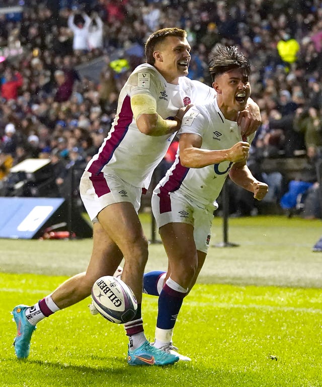 Marcus Smith (right) celebrates with Henry Slade after scoring England's first try against Scotland