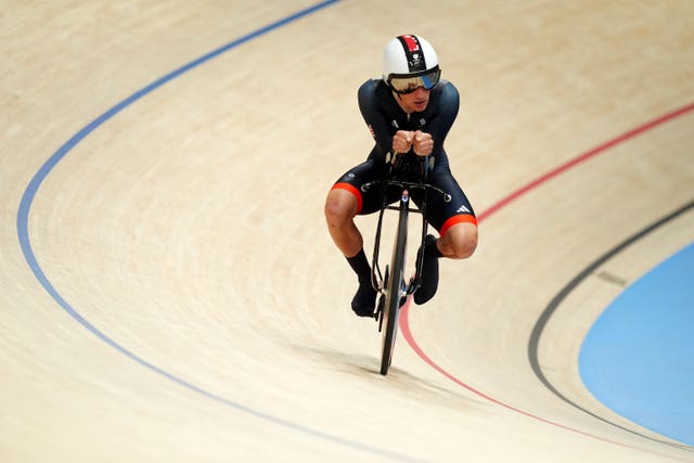 Ethan Hayter sat on his bike on the velodrome track in Paris. 