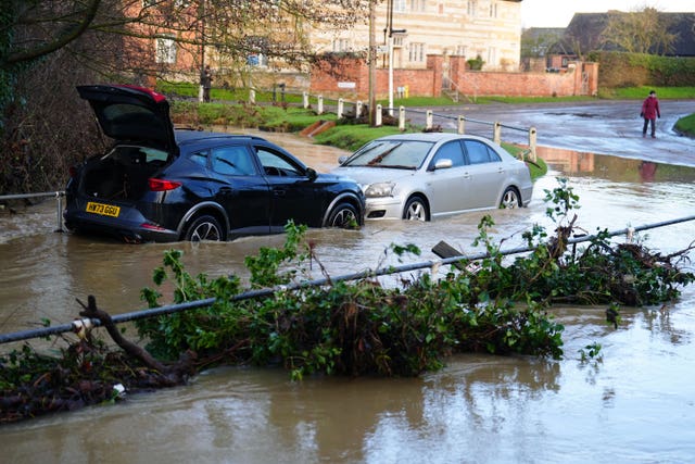 Vehicles in flood water near the River Devon, in Bottesford, Leicestershire