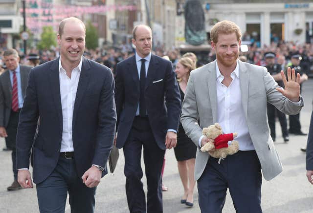 Double act: Prince Harry and his best man, the Duke of Cambridge, meet members of the public outside Windsor Castle (Jonathan Brady/PA)