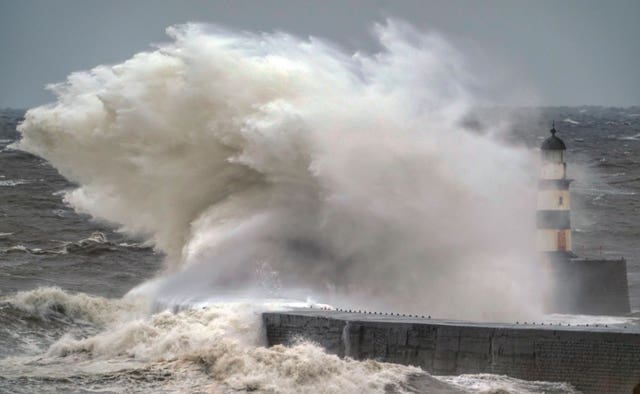 Huge waves crash over Seaham lighthouse in Co Durham