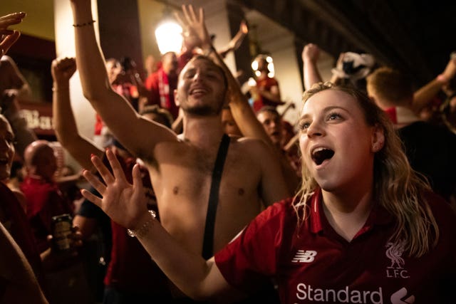 Liverpool fans celebrate in Madrid after seeing their team win the Champions League final 