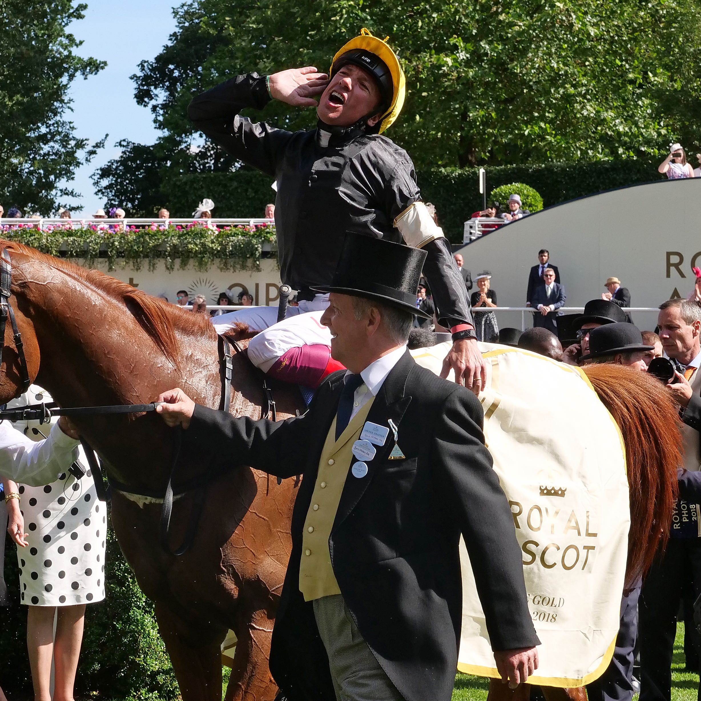 Jockey Frankie Dettori soaks up the applause as Stradivarius returns to the winner's enclosure following the Gold Cup at Royal Ascot
