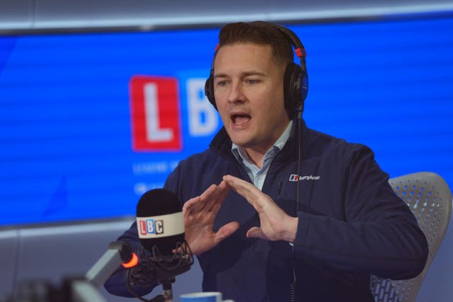 Wes Streeting wearing headphones in the LBC studio