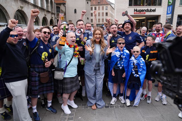 Presenter Laura Woods poses for a photo with Scotland fans