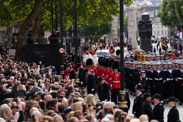 Crowds watch the Queen's funeral procession