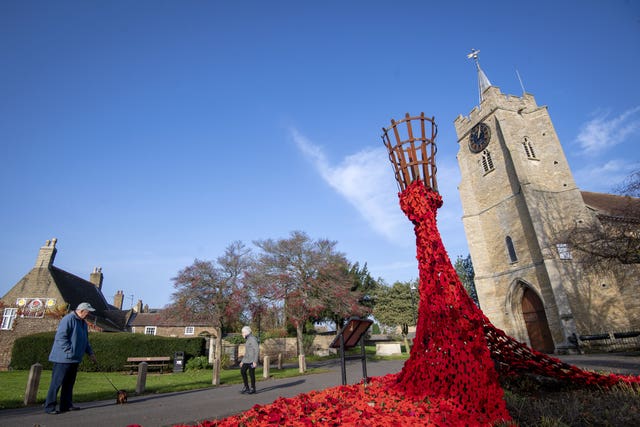 Knitted poppies outside church