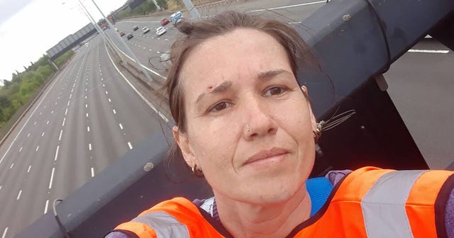 One of the activists who has climbed motorway signs on the M25
