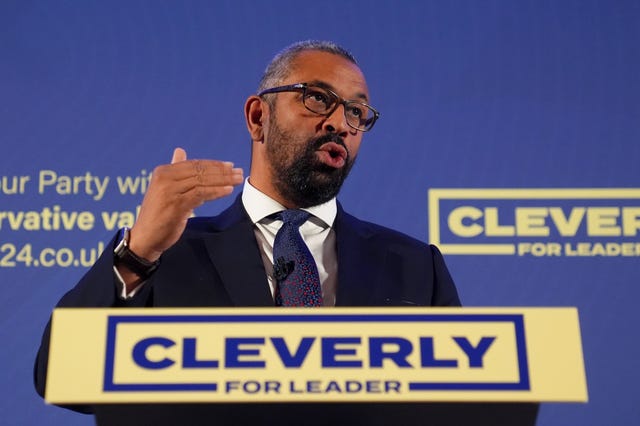 James Cleverly delivers a speech from behind a lectern with the slogan 'Cleverly for leader'