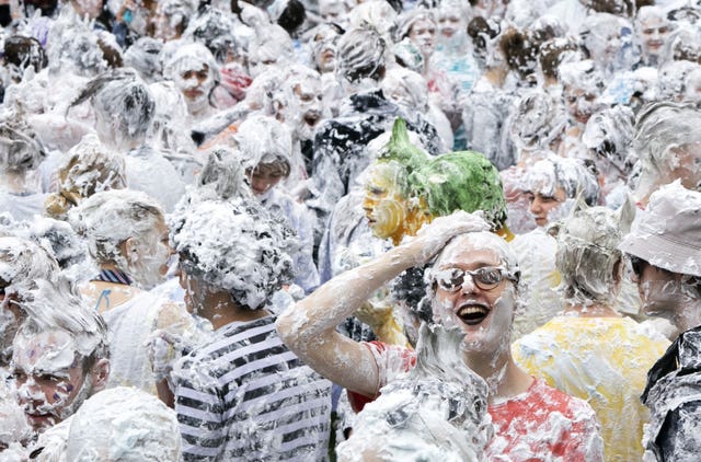 Hundreds of students take part in the traditional Raisin Monday foam fight on St Salvator’s Lower College Lawn at the University of St Andrews in Fife