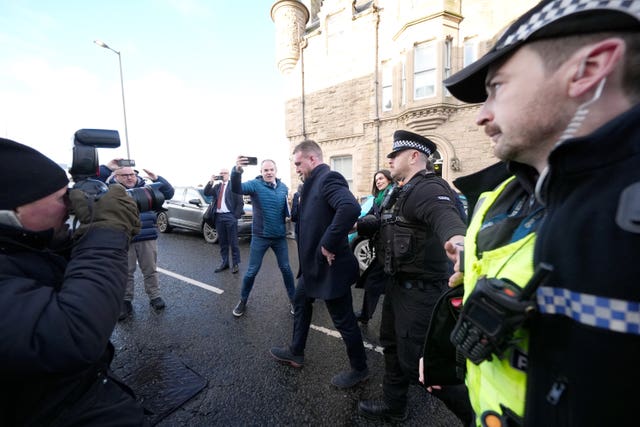 Stuart Hogg surrounded by police and photographers