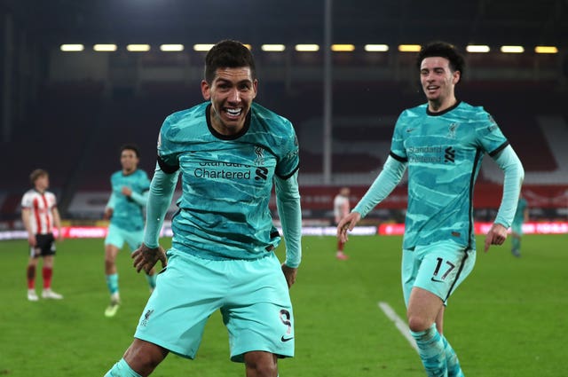 Liverpool’s Roberto Firmino celebrates their second goal