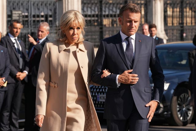 President of France Emmanuel Macron and his wife Brigitte Macron attend a ceremony at the Statue of Sir Winston Churchill in Parliament Square, central London, on day one of the French president’s state visit to the UK