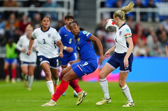 England’s Leah Williamson and France’s Marie-Antoinette Katoto battle for the ball