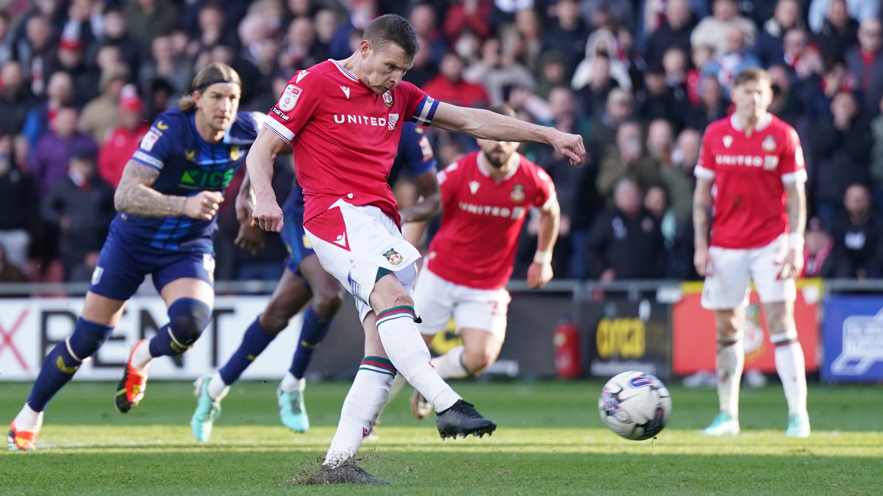 Paul Mullin blasts home Wrexham’s second goal from the penalty spot (Jacob King/PA)