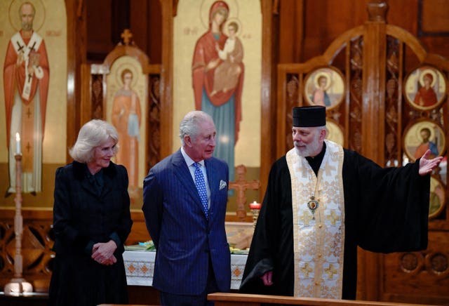 The Prince of Wales and Duchess of Cornwall with bishop Kenneth Nowakowski (right) (Toby Melville/PA)