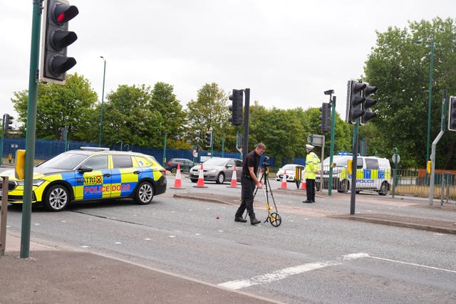 Police at work at a cordon near the scene of the fatal crash