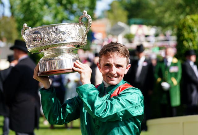 Chris Hayes gets his hands on the trophy 